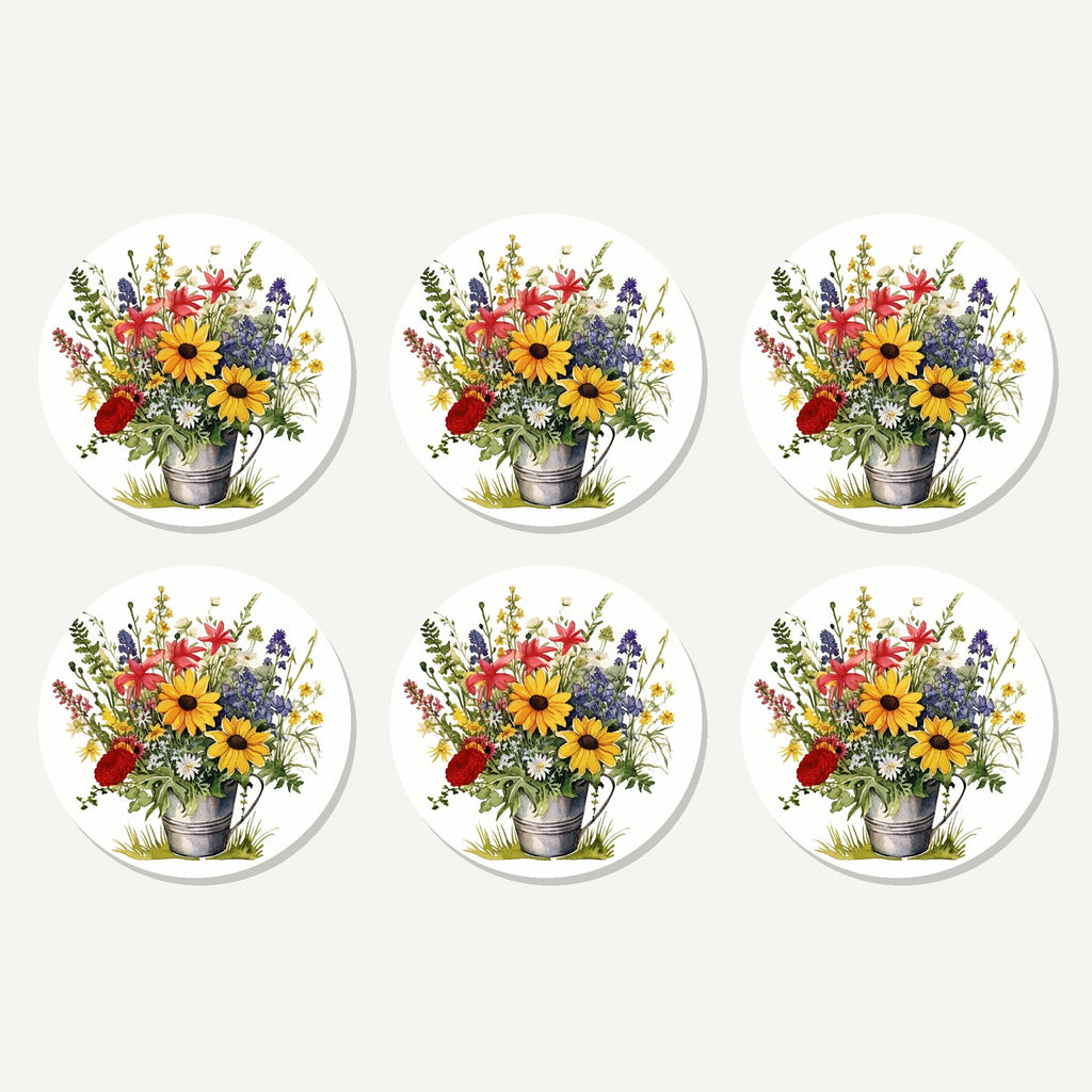 Flat lay of the sunflowers in a tin bucket artwork on six round coasters