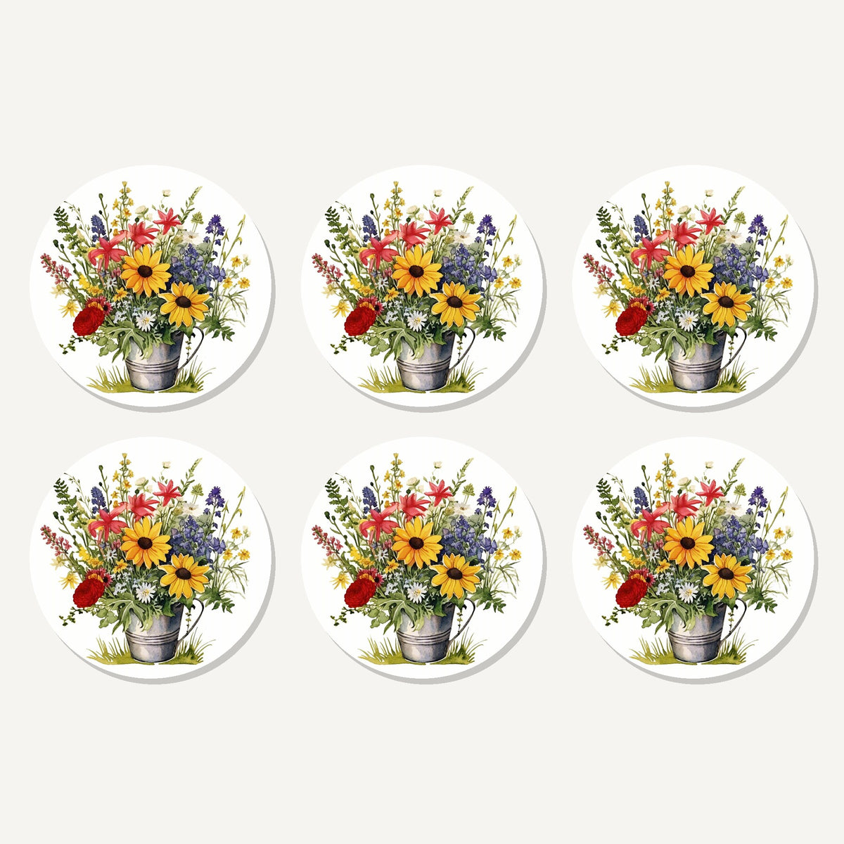 Flat lay of the sunflowers in a tin bucket artwork on six round coasters