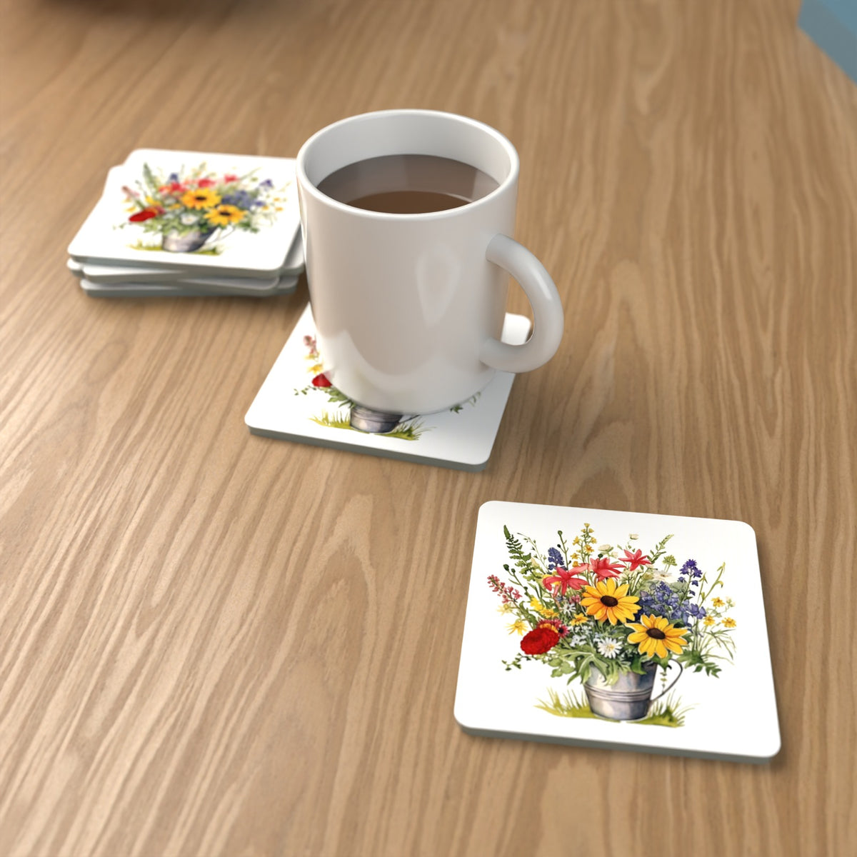 Sunflowers in a Tin Bucket Square Glass Coasters – Set of 6 – lifestyle mockup with a mug of coffee