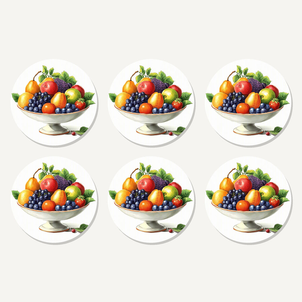 Flat lay of the fruit in a footed bowl artwork on six round coasters