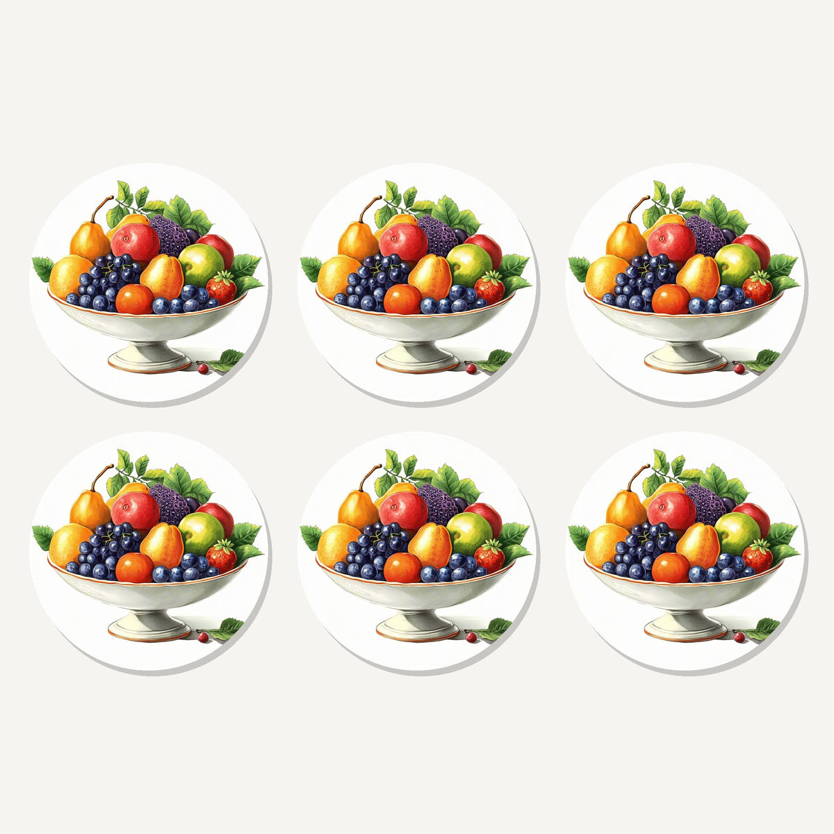 Flat lay of the fruit in a footed bowl artwork on six round coasters