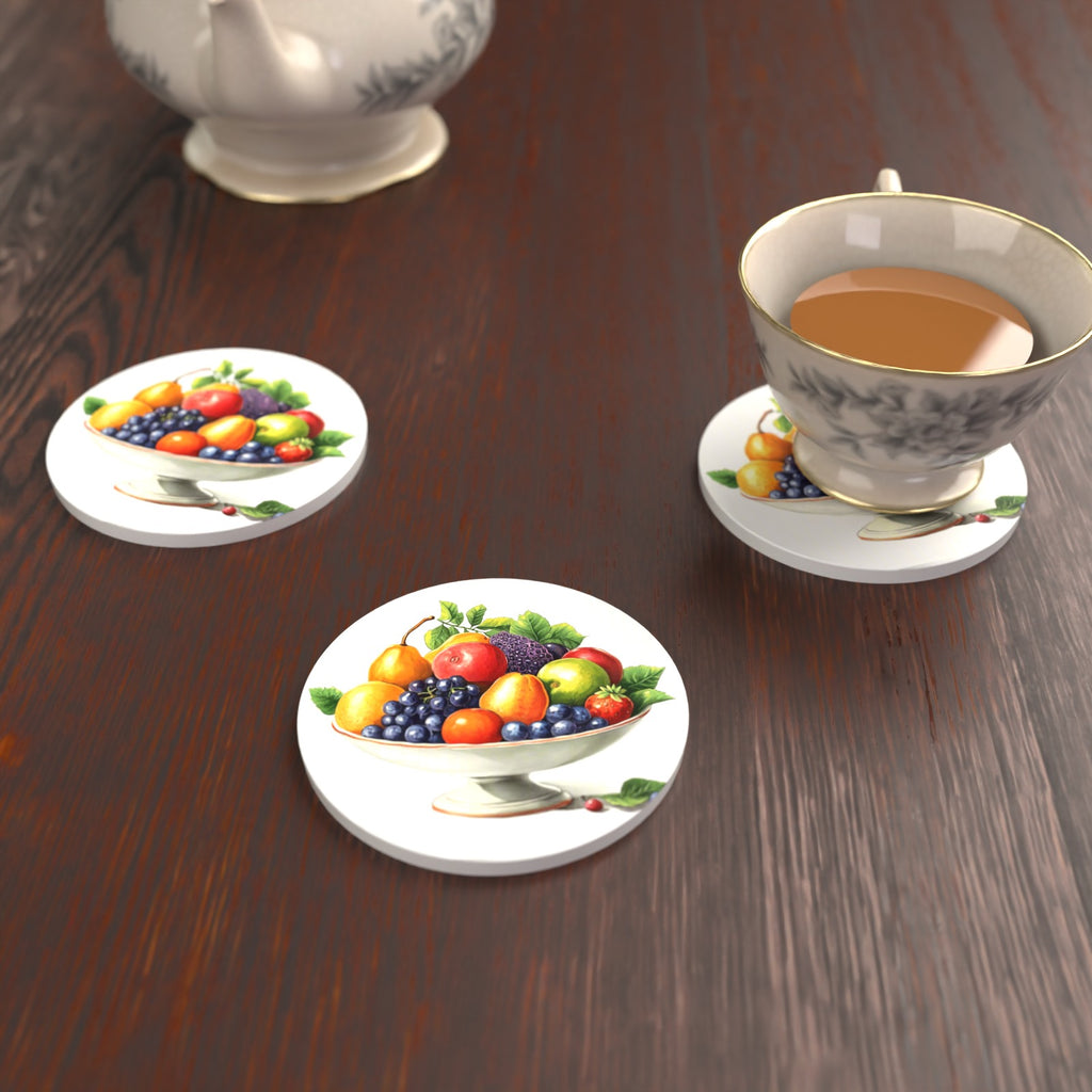 Fruit in a Footed Bowl Round Ceramic Coasters – Set of 6 – lifestyle mockup with a teacup