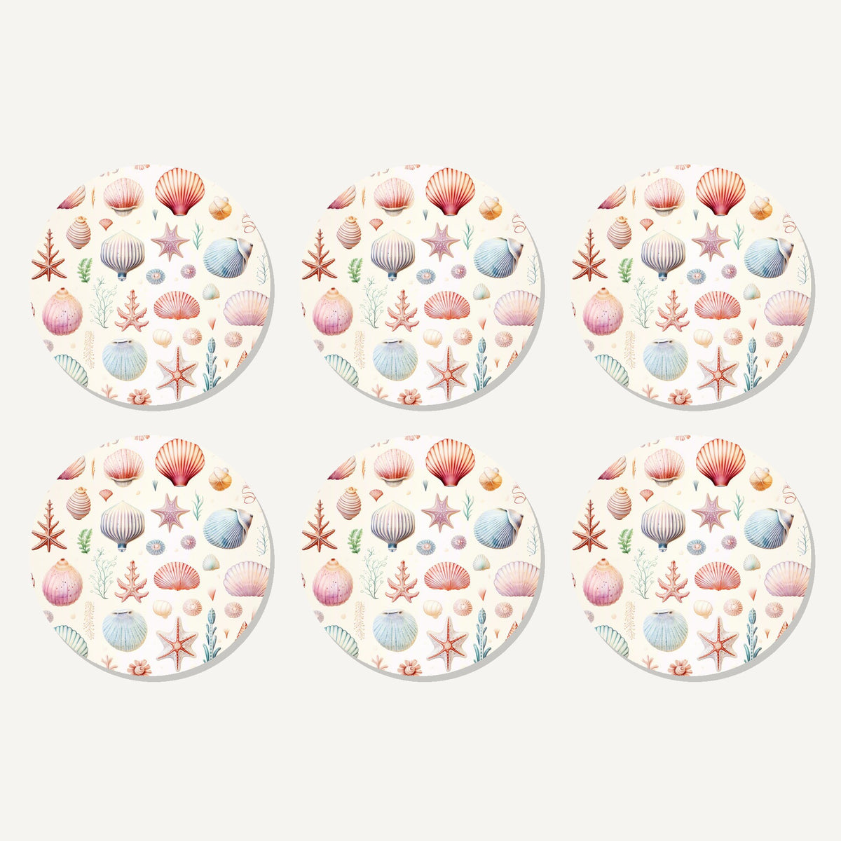 Flat lay of the seashell pattern artwork on six round coasters