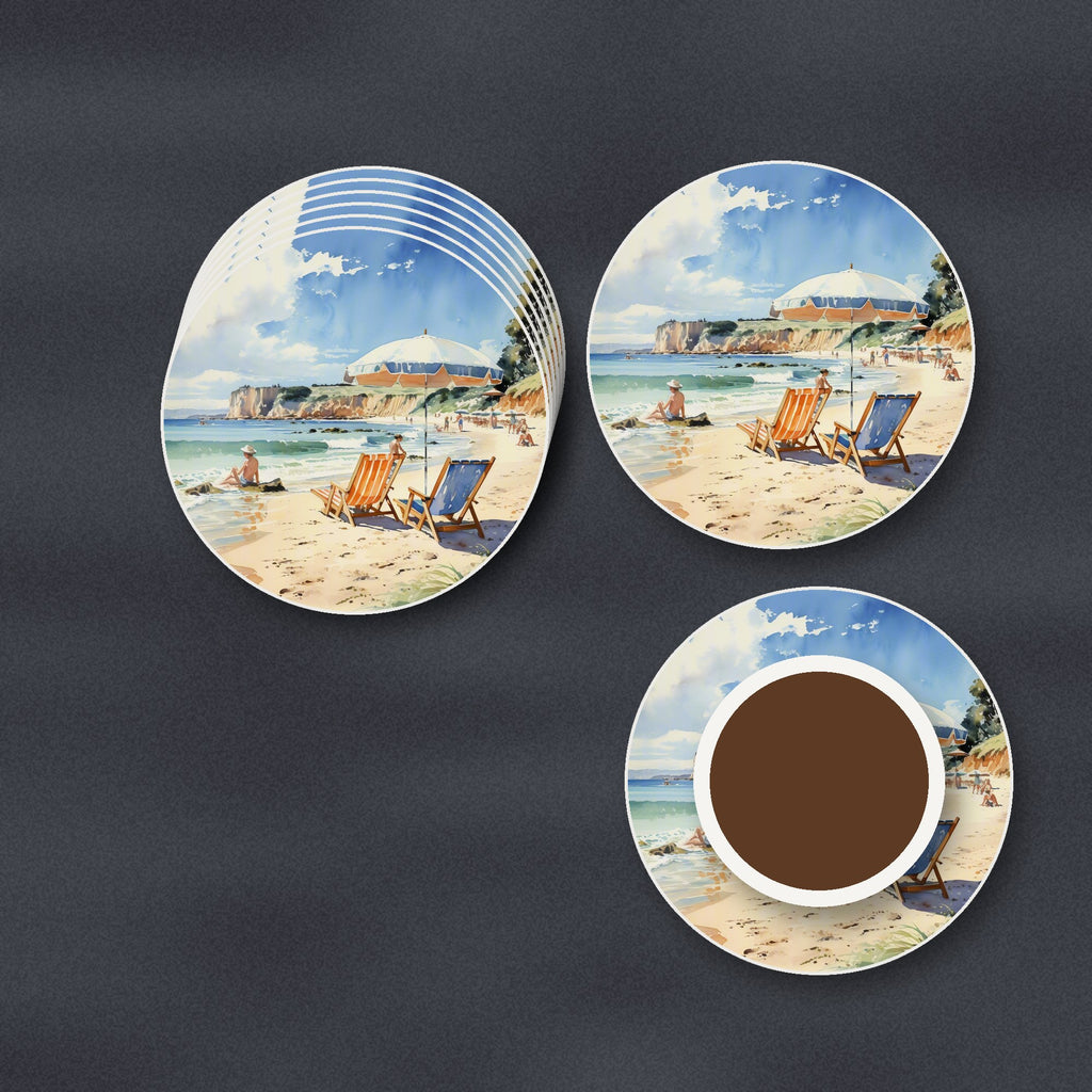 Watercolour Beach Deckchairs & Cliffs round ceramic coasters stacked on a slate kitchen worktop