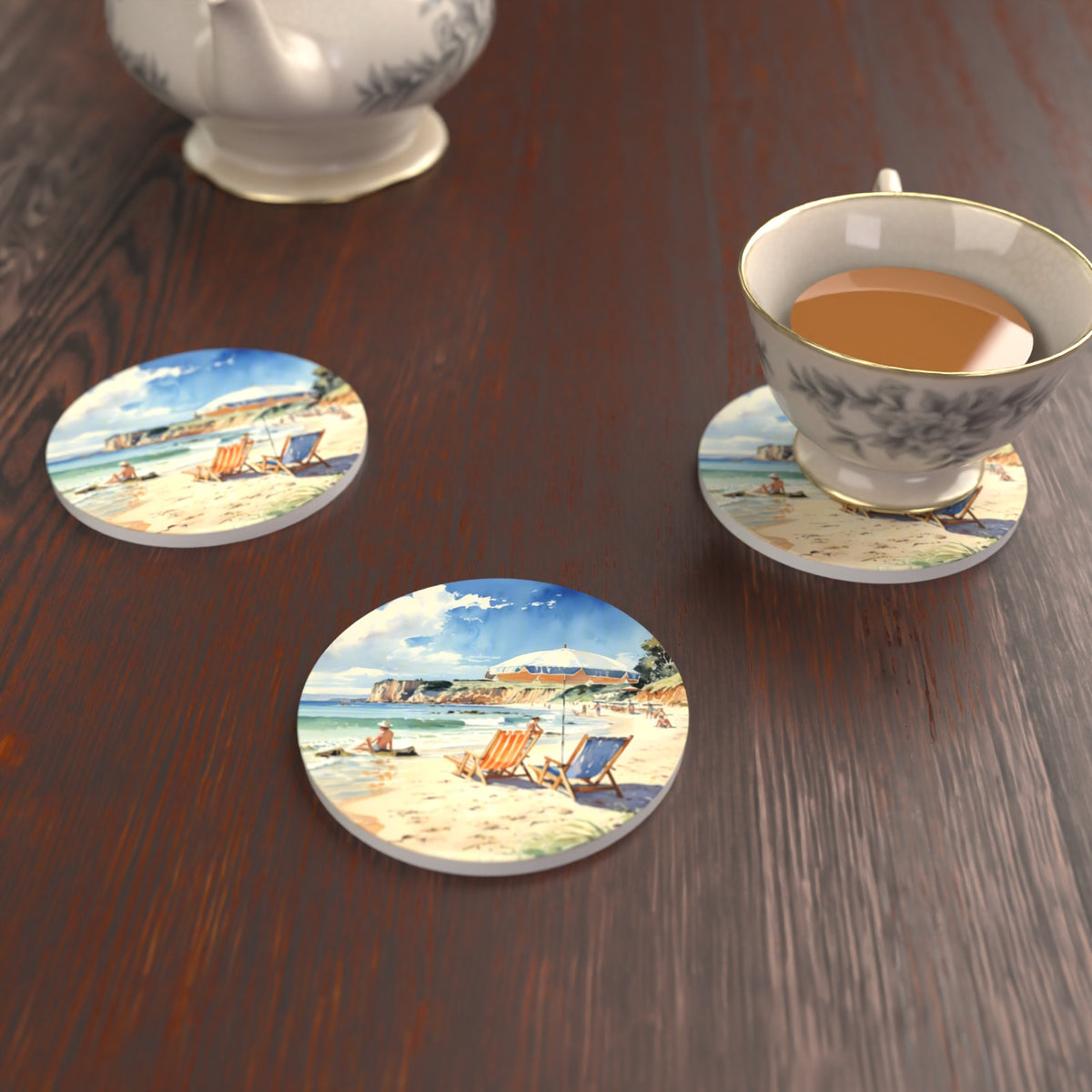 Watercolour Beach Deckchairs & Cliffs Round Ceramic Coasters – Set of 6 – lifestyle mockup with a teacup