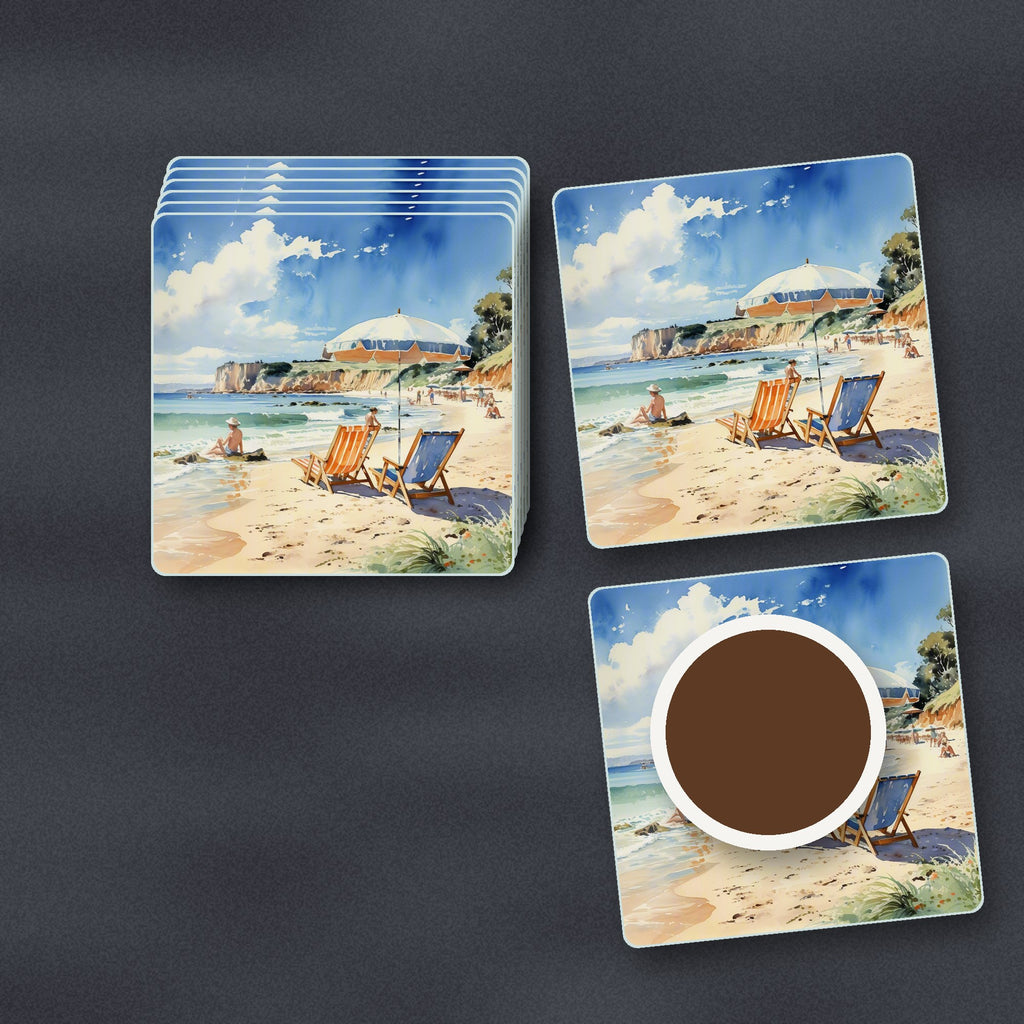 Watercolour Beach Deckchairs & Cliffs square glass coasters stacked on a slate kitchen worktop