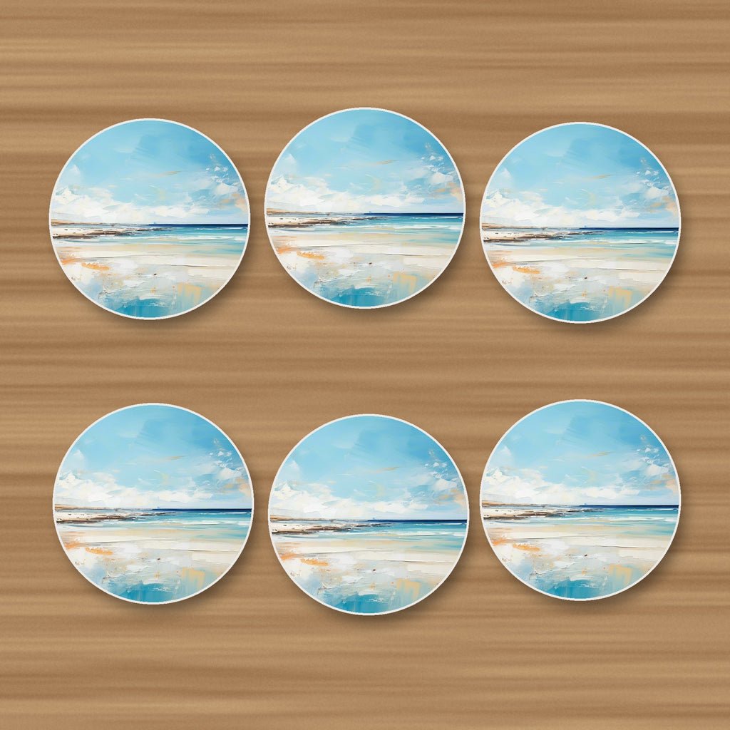 Watercolour Calm Sea & Sky round ceramic coasters, set of 6, on an oak coffee table