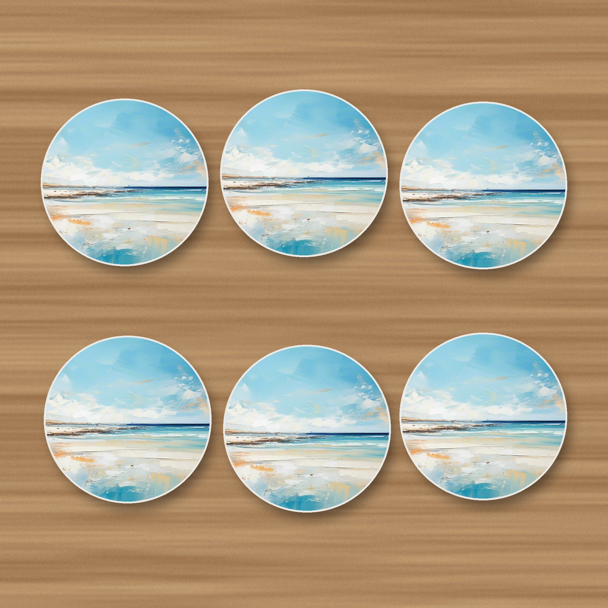 Watercolour Calm Sea & Sky round ceramic coasters, set of 6, on an oak coffee table