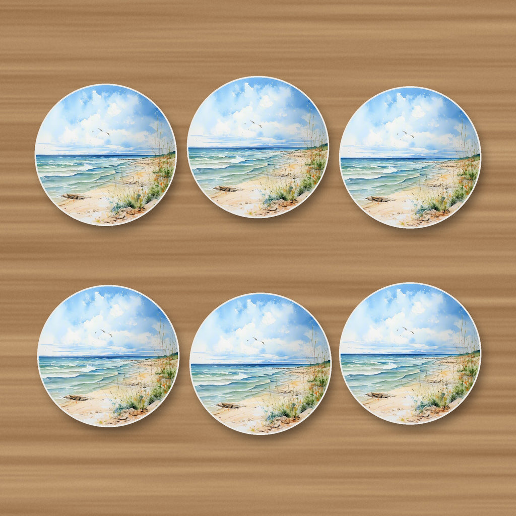 Dunes & Breaking Waves round ceramic coasters, set of 6, on an oak coffee table