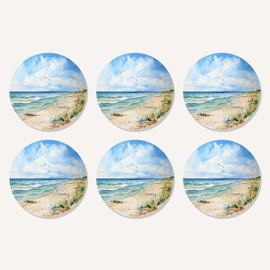 Flat lay of the dunes & breaking waves artwork on six round coasters