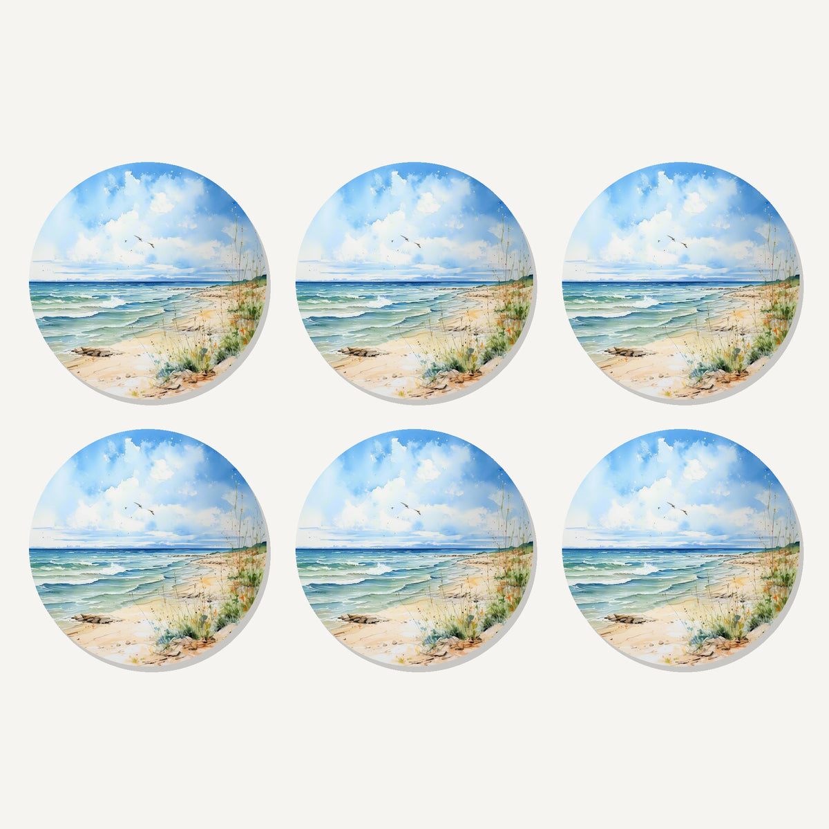 Flat lay of the dunes & breaking waves artwork on six round coasters