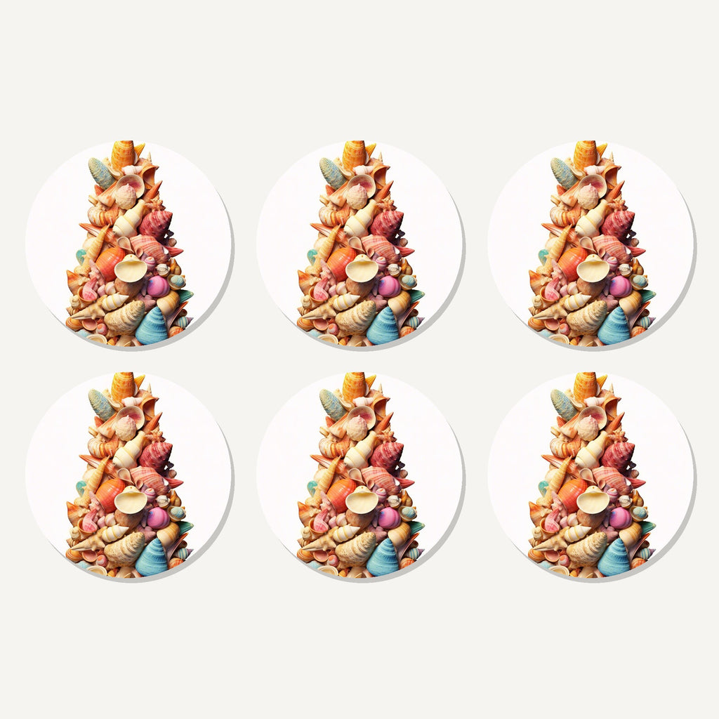 Flat lay of the seashell tower artwork on six round coasters