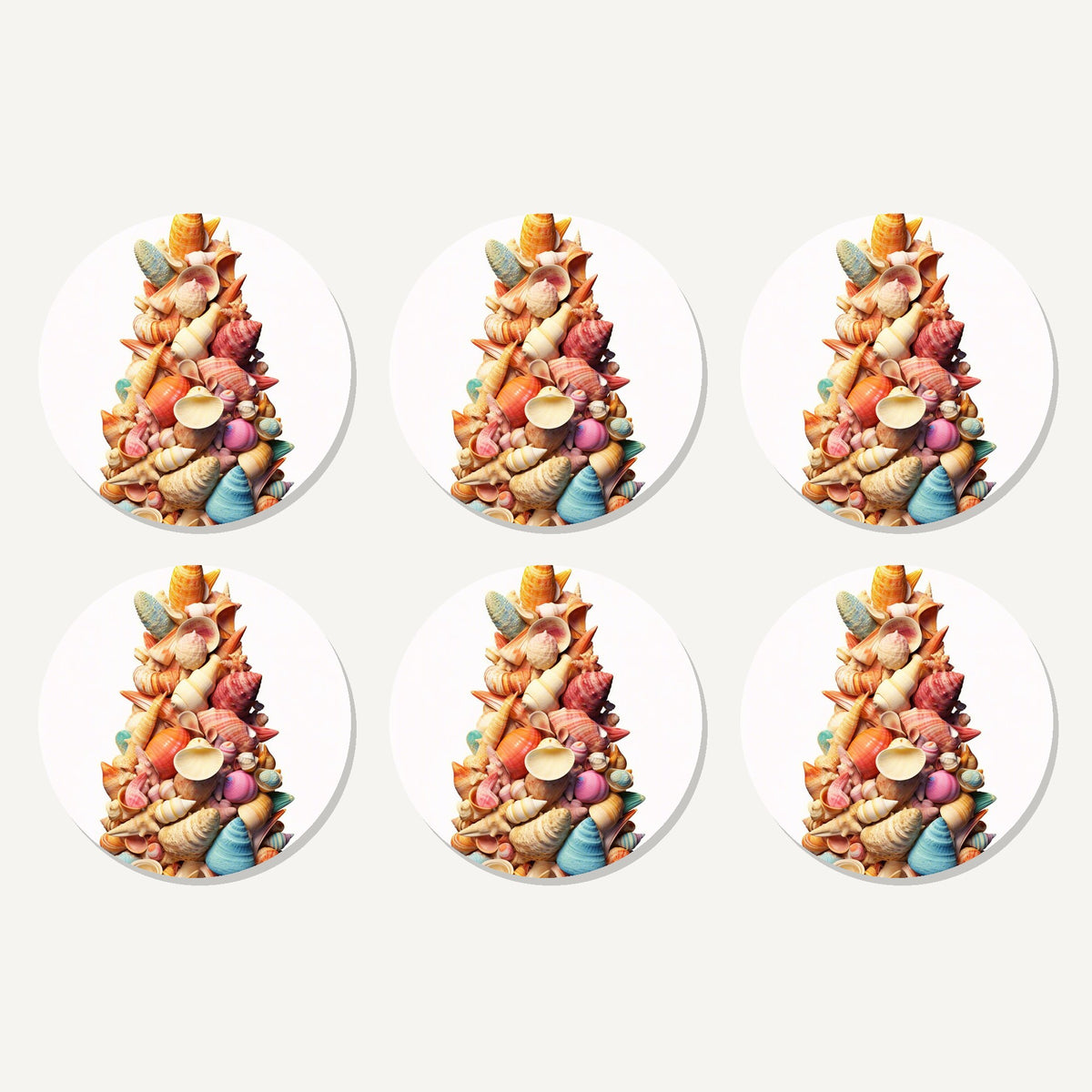 Flat lay of the seashell tower artwork on six round coasters