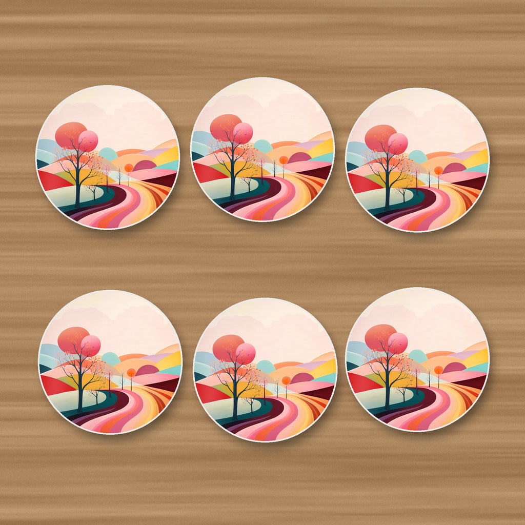 Winding Road through Pastel Hills round ceramic coasters, set of 6, on an oak coffee table