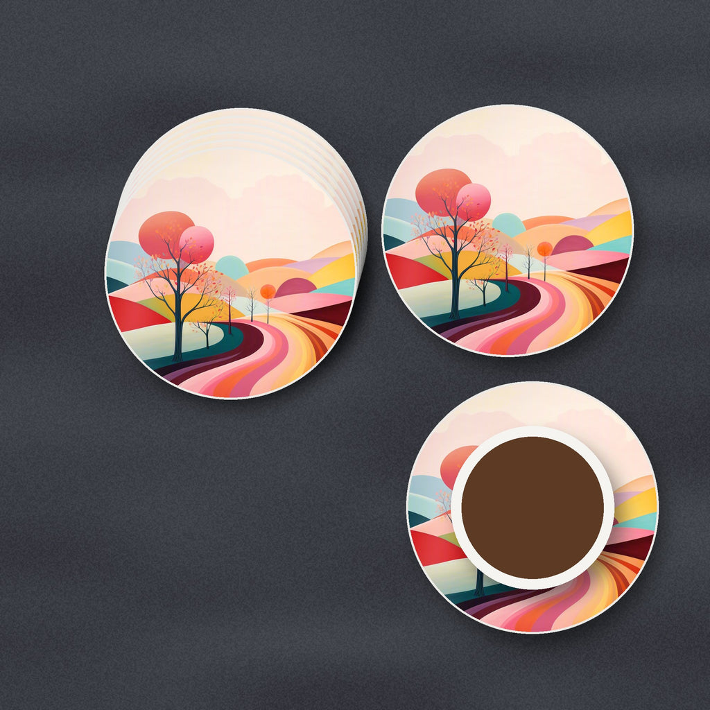 Winding Road through Pastel Hills round ceramic coasters stacked on a slate kitchen worktop