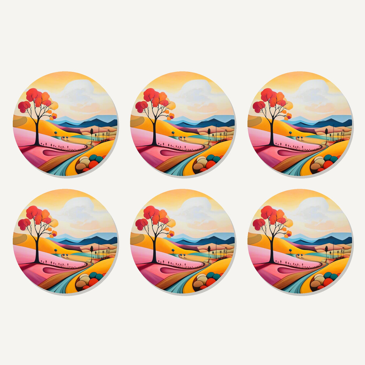 Flat lay of the colourful hills & red tree artwork on six round coasters