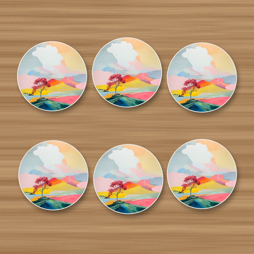 Lone Pink Tree on the Hill round ceramic coasters, set of 6, on an oak coffee table