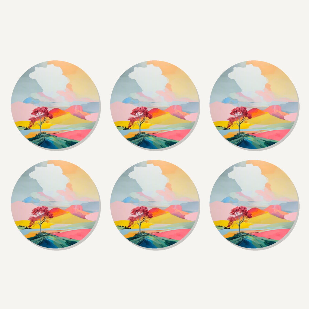 Flat lay of the lone pink tree on the hill artwork on six round coasters