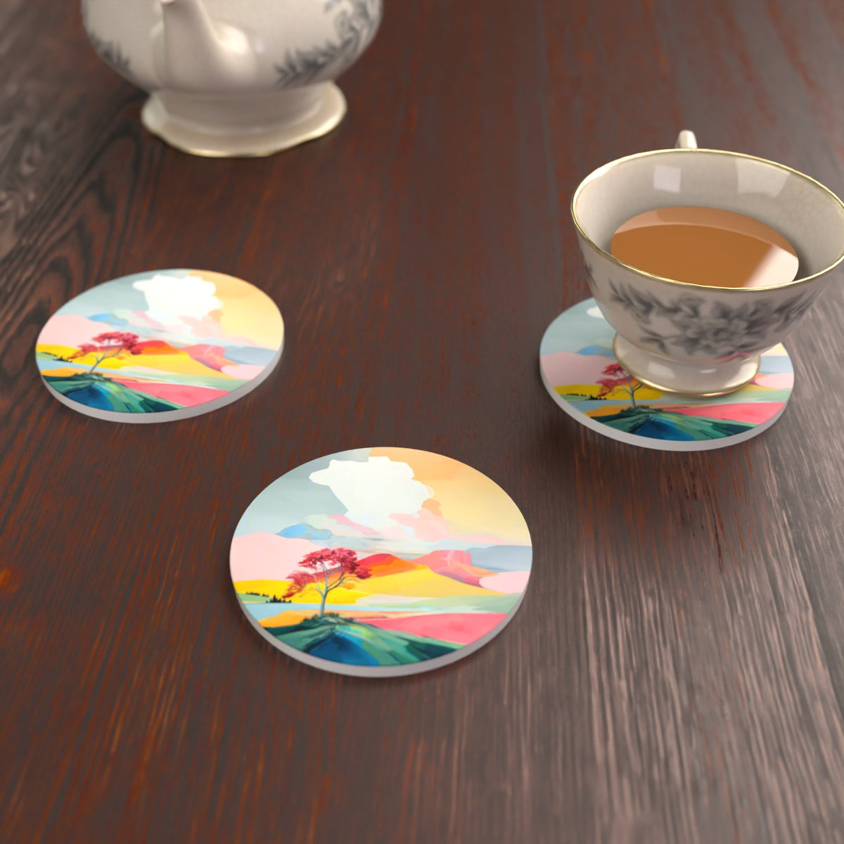 Lone Pink Tree on the Hill Round Ceramic Coasters – Set of 6 – lifestyle mockup with a teacup