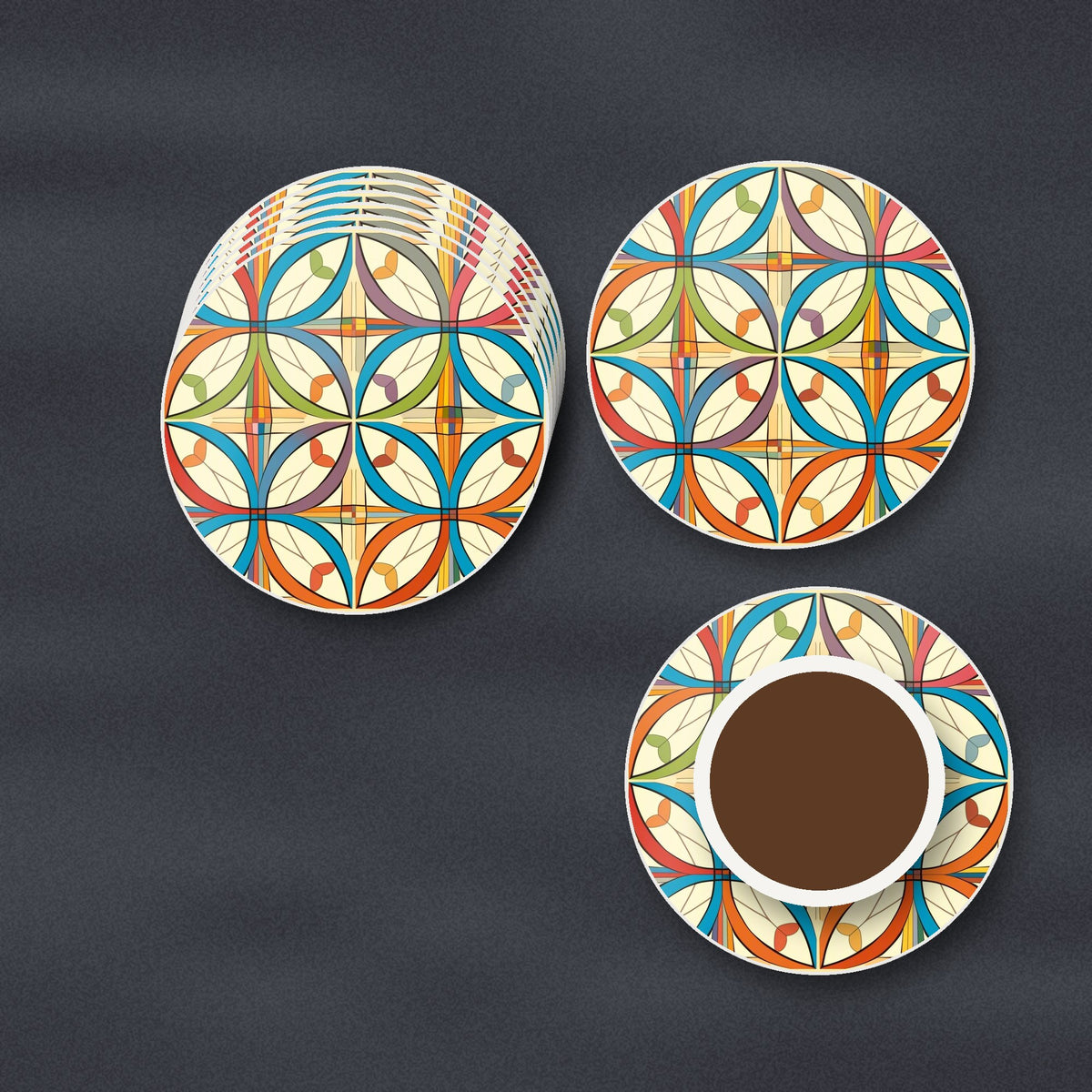 Retro Quatrefoil Tile Pattern round ceramic coasters stacked on a slate kitchen worktop