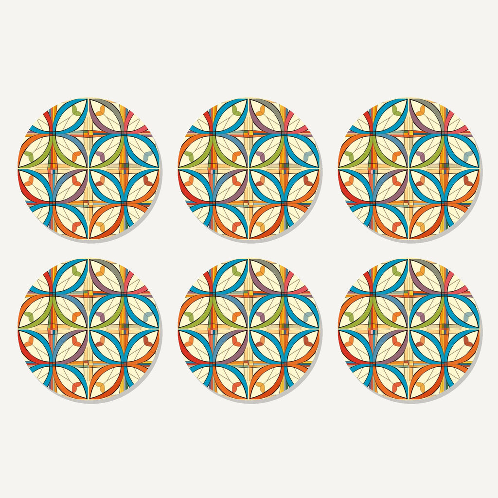 Flat lay of the retro quatrefoil tile pattern artwork on six round coasters