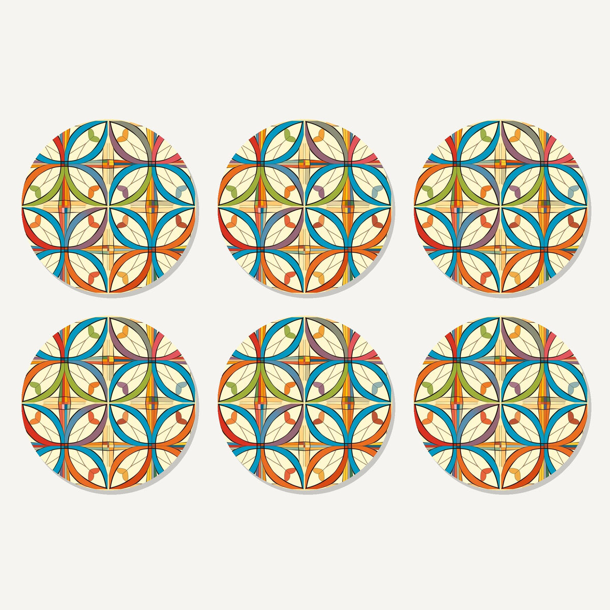Flat lay of the retro quatrefoil tile pattern artwork on six round coasters