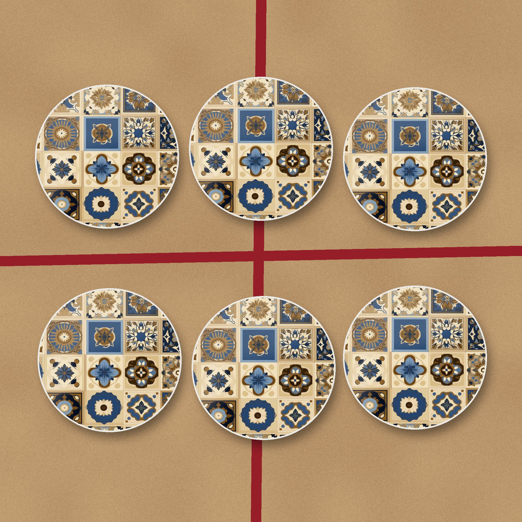 Navy & Gold Patterned Tiles round ceramic coasters on kraft gift wrap