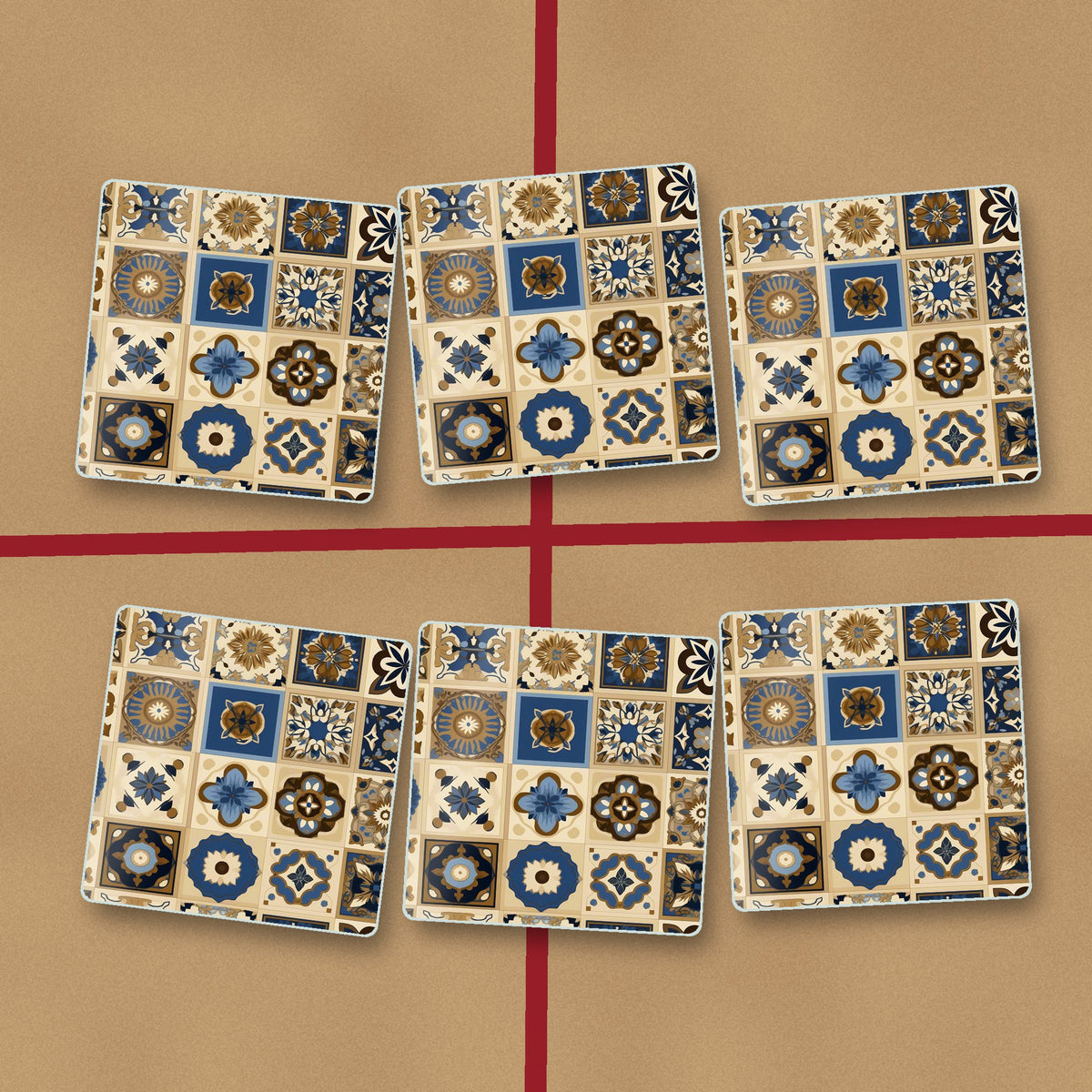 Navy & Gold Patterned Tiles square glass coasters on kraft gift wrap