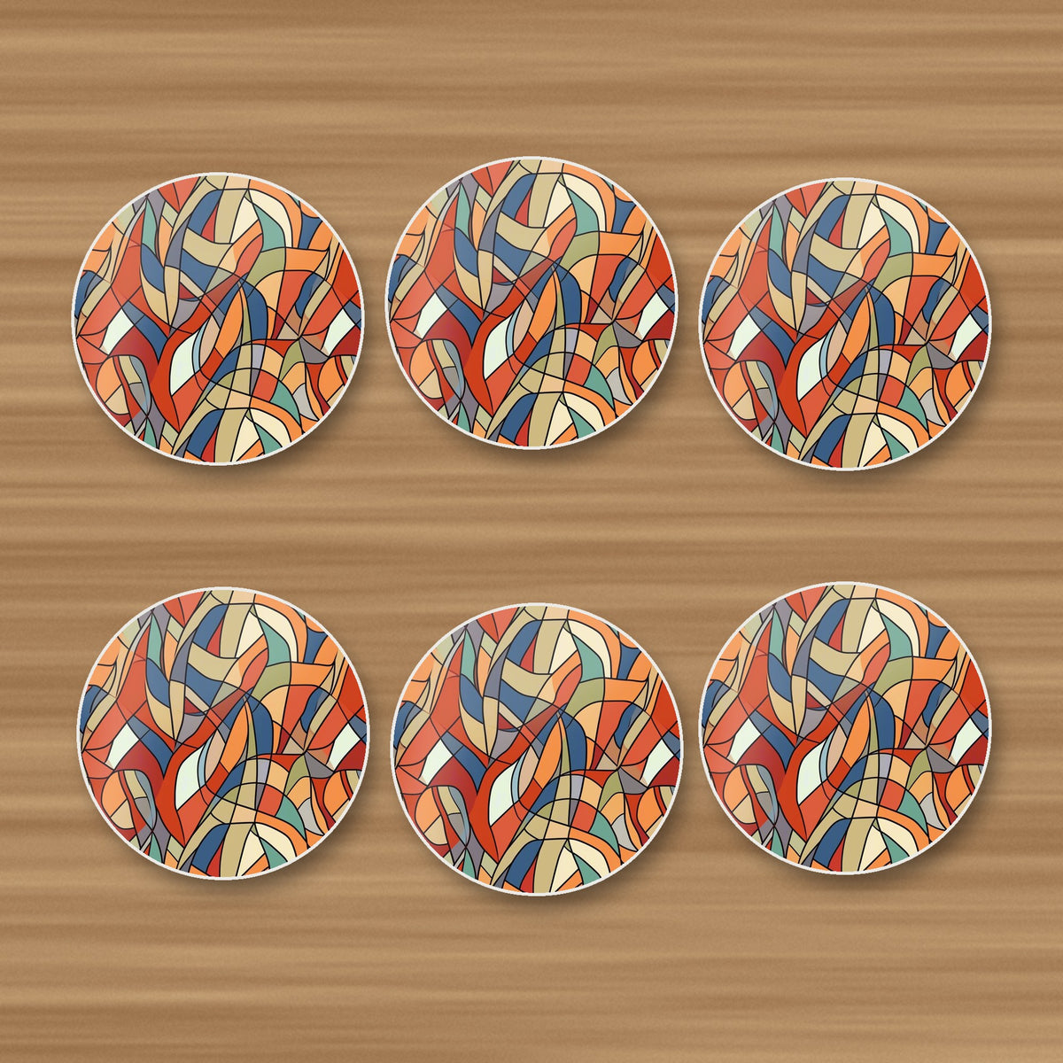 Stained Glass Swirl Abstract round ceramic coasters, set of 6, on an oak coffee table