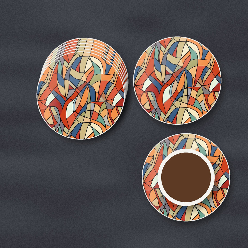 Stained Glass Swirl Abstract round ceramic coasters stacked on a slate kitchen worktop
