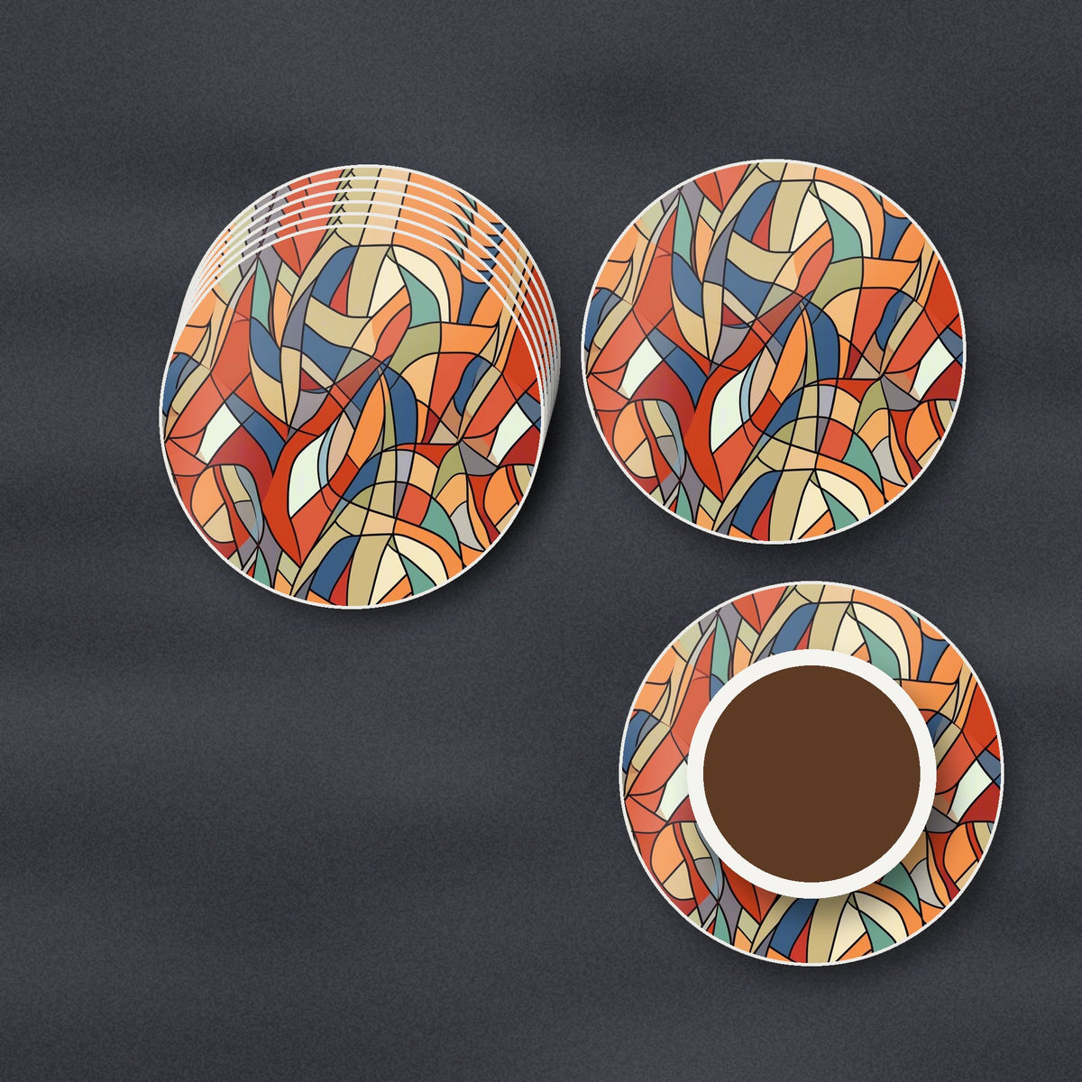 Stained Glass Swirl Abstract round ceramic coasters stacked on a slate kitchen worktop