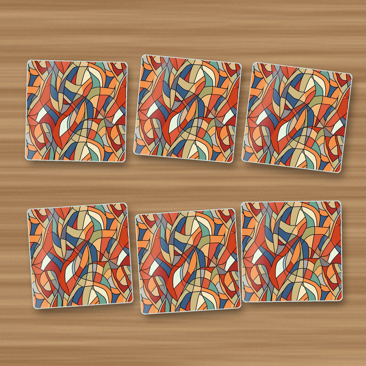 Stained Glass Swirl Abstract square glass coasters, set of 6, on an oak coffee table