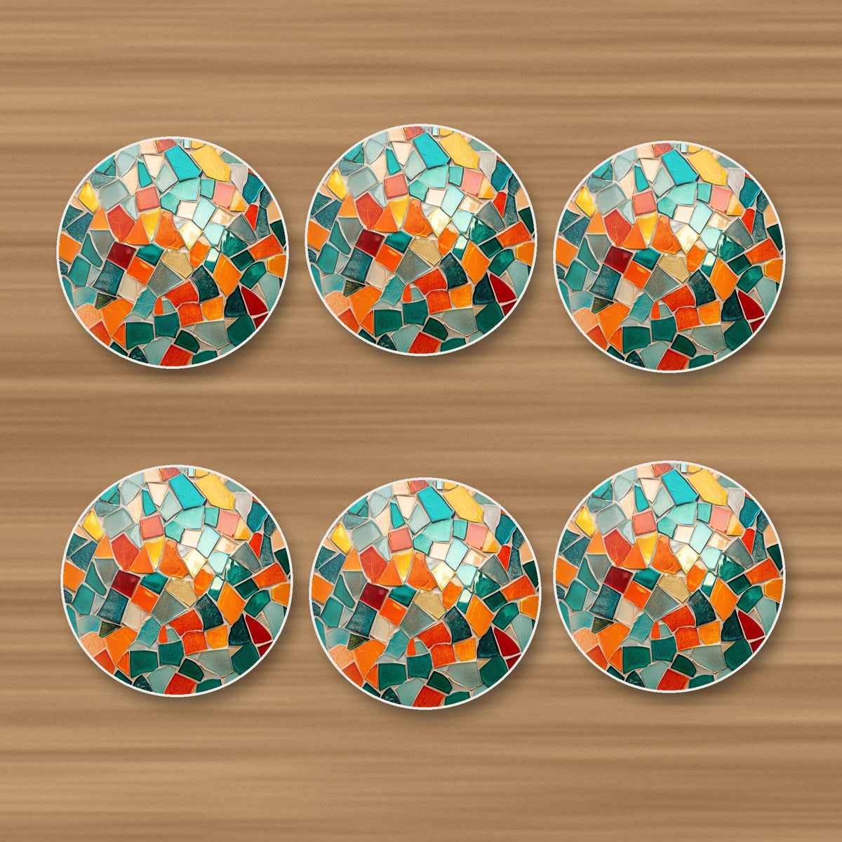 Teal & Orange Mosaic round ceramic coasters, set of 6, on an oak coffee table