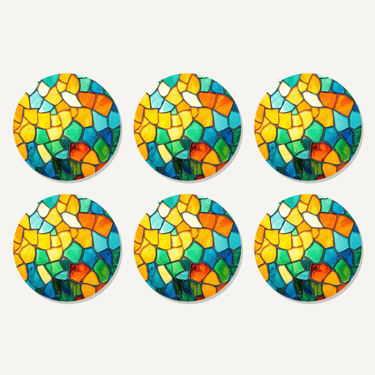 Flat lay of the sunny stained glass mosaic artwork on six round coasters