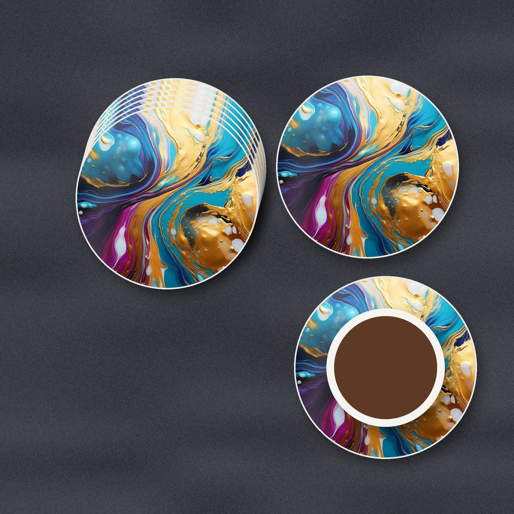 Blue & Gold Fluid Art round ceramic coasters stacked on a slate kitchen worktop