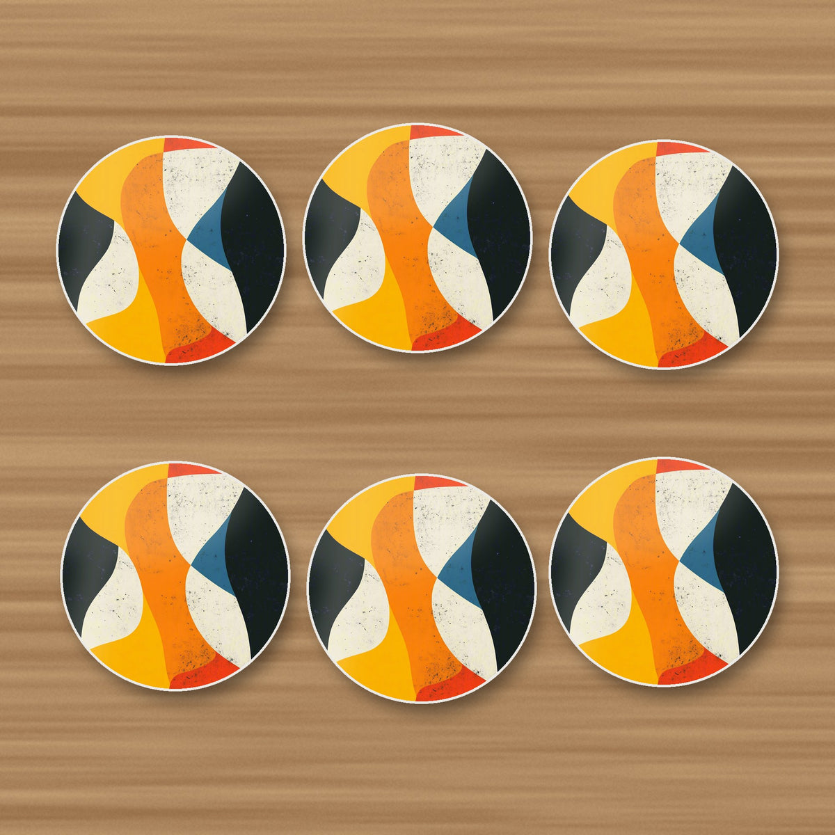 Mid-Century Abstract Shapes round ceramic coasters, set of 6, on an oak coffee table