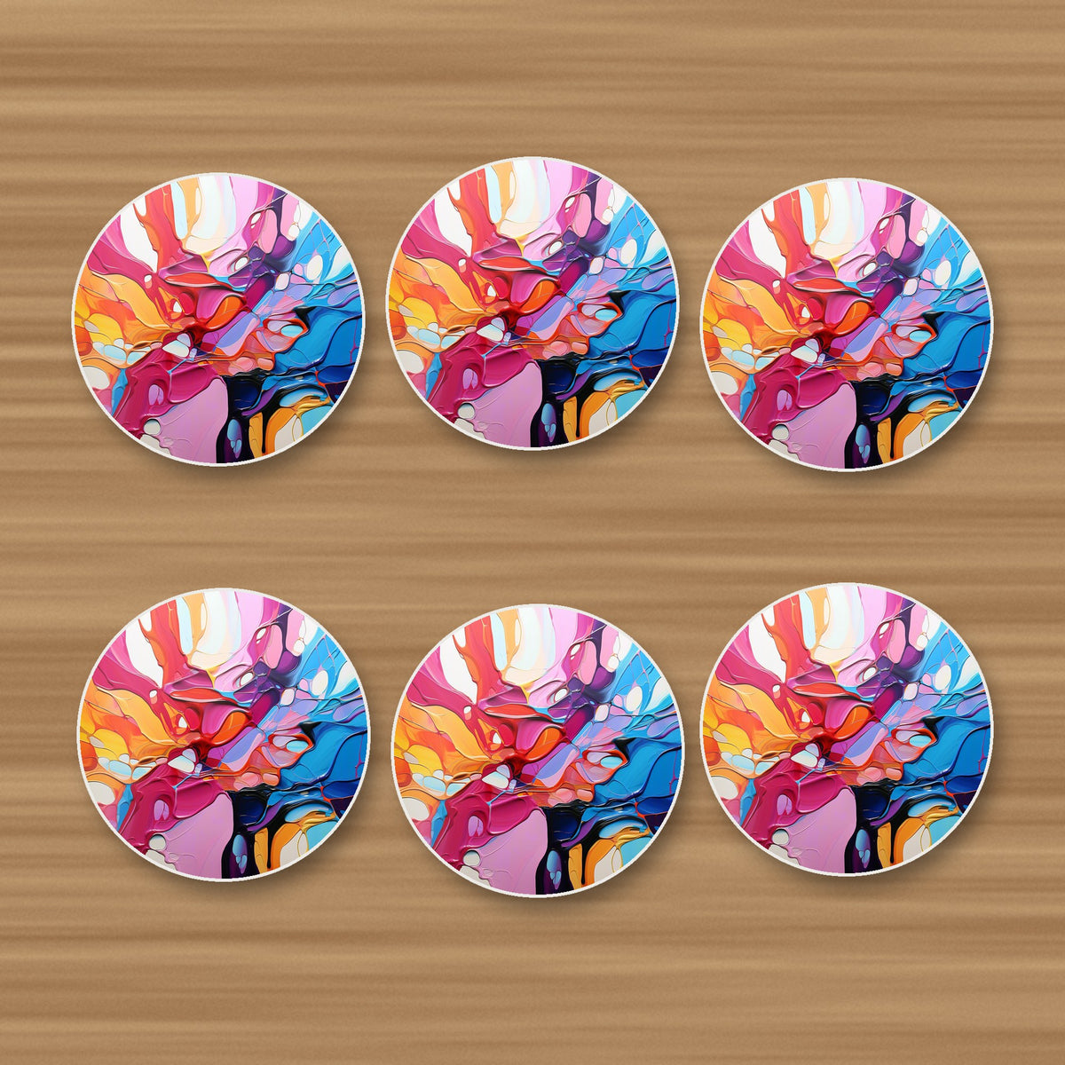 Colour Burst Fluid Art round ceramic coasters, set of 6, on an oak coffee table