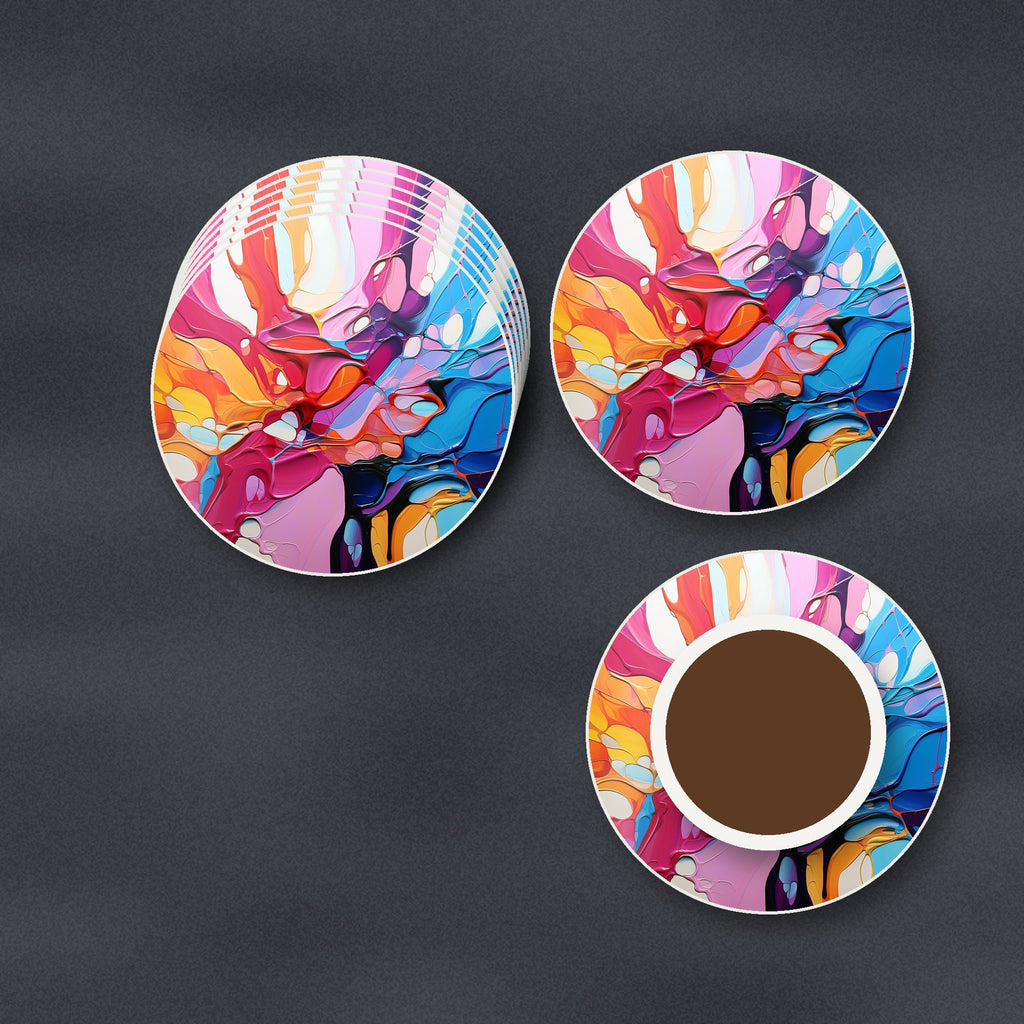 Colour Burst Fluid Art round ceramic coasters stacked on a slate kitchen worktop
