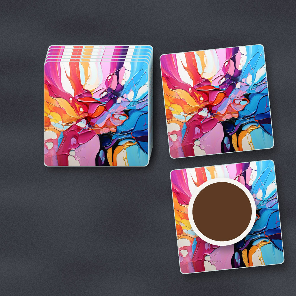 Colour Burst Fluid Art square glass coasters stacked on a slate kitchen worktop