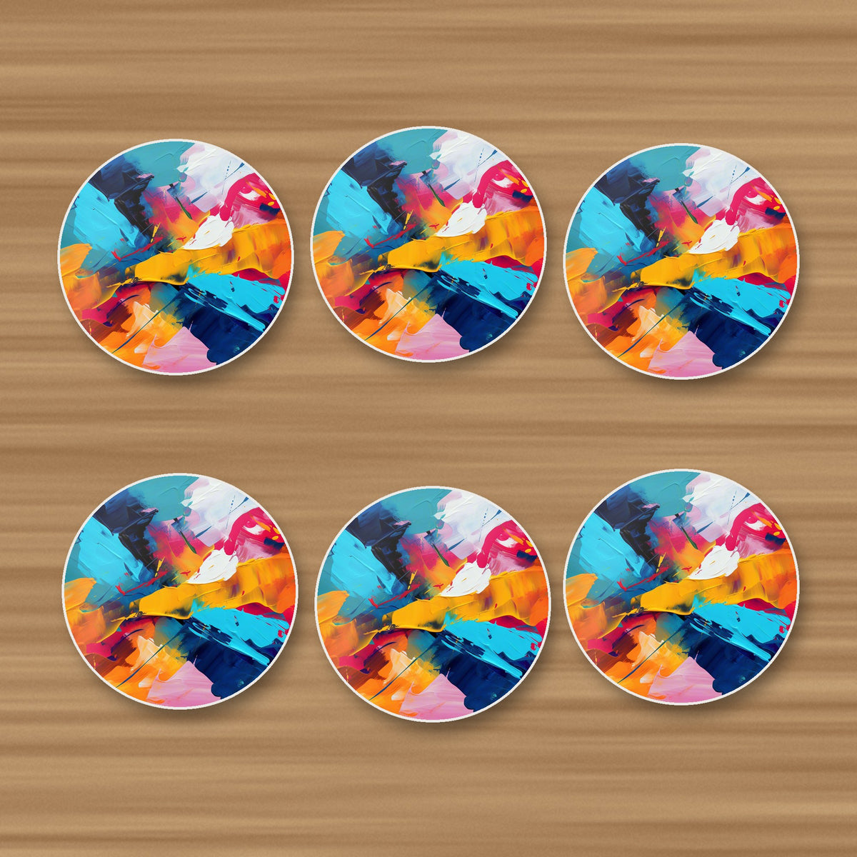 Bold Brushstroke Abstract round ceramic coasters, set of 6, on an oak coffee table
