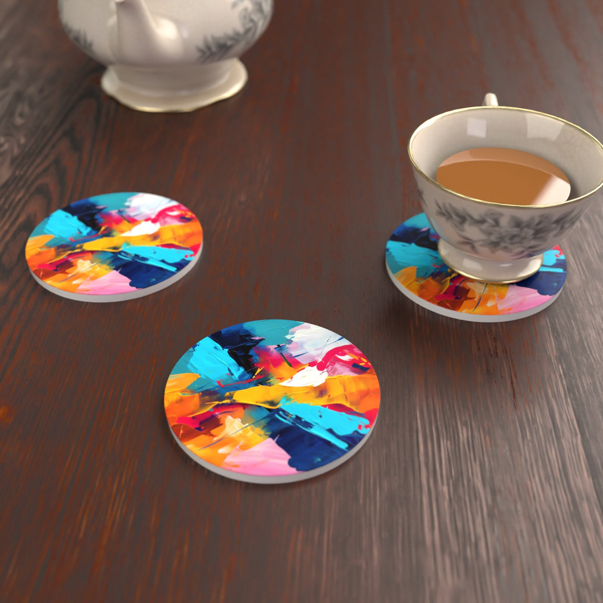 Bold Brushstroke Abstract Round Ceramic Coasters – Set of 6 – lifestyle mockup with a teacup