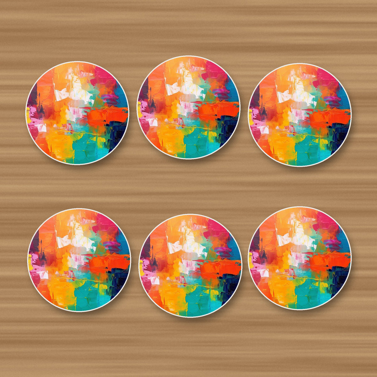Sunset Palette Knife Abstract round ceramic coasters, set of 6, on an oak coffee table
