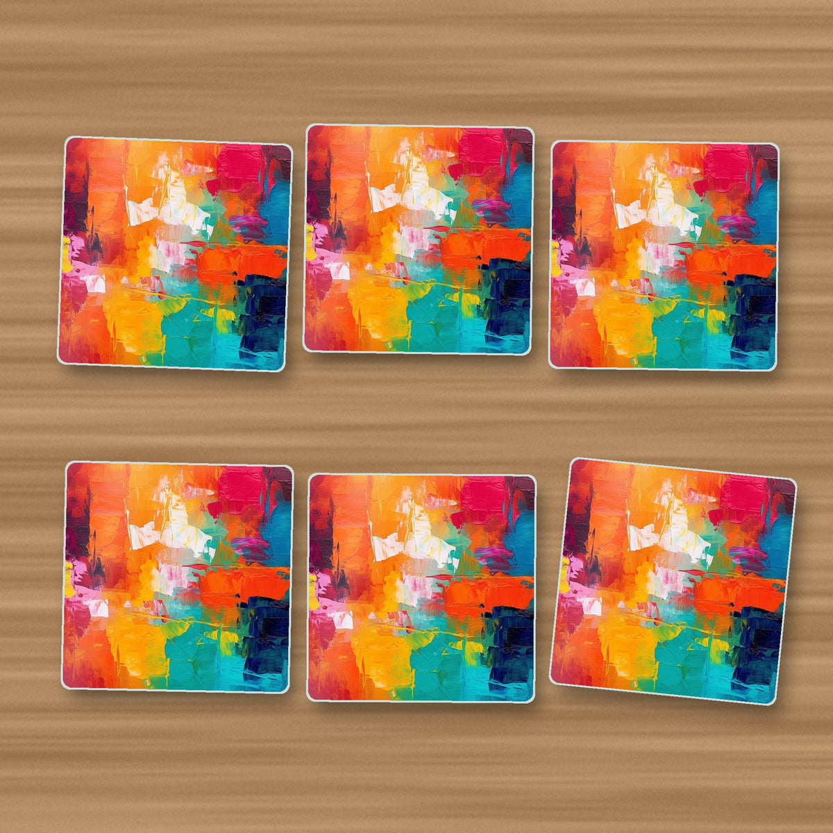 Sunset Palette Knife Abstract square glass coasters, set of 6, on an oak coffee table