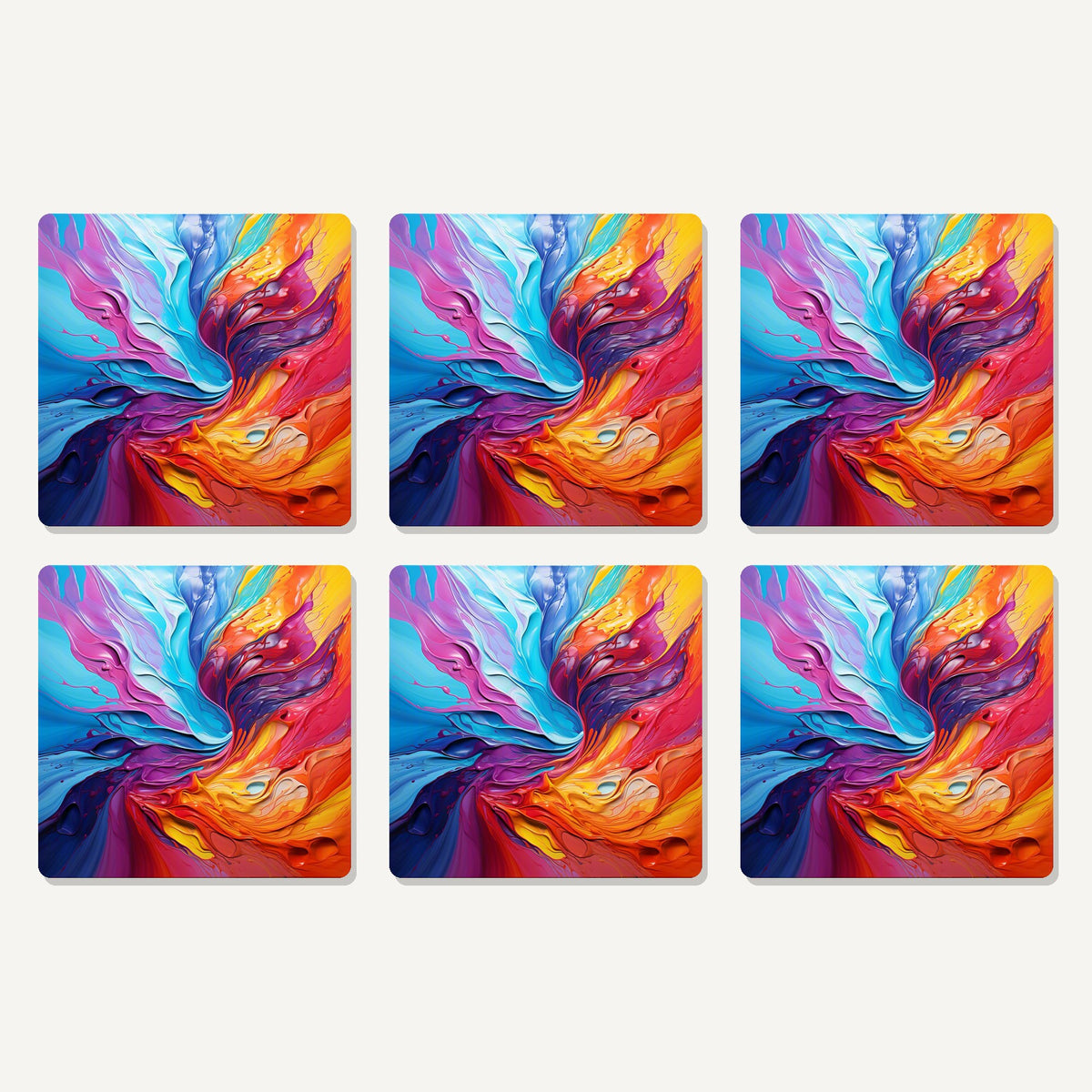 Flat lay of the rainbow paint swirl artwork on six square coasters