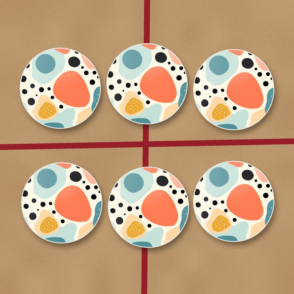 Boho Blobs & Dots round ceramic coasters on kraft gift wrap