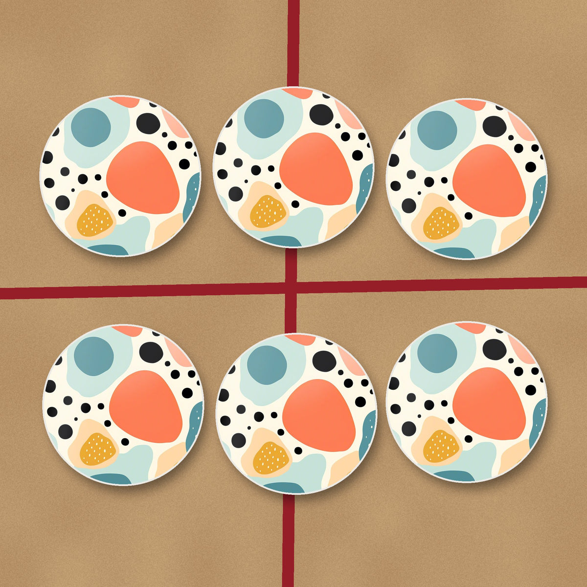 Boho Blobs & Dots round ceramic coasters on kraft gift wrap