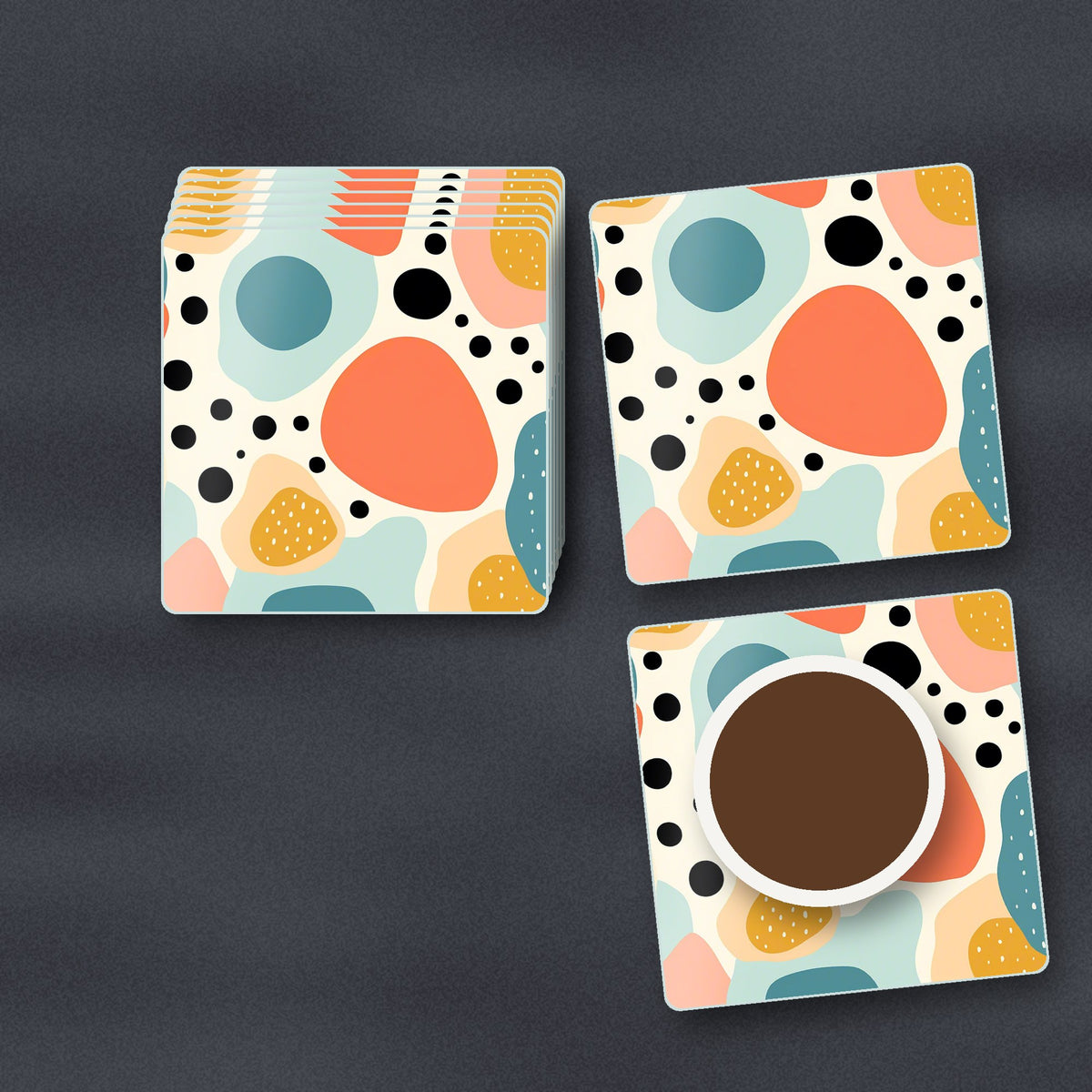Boho Blobs & Dots square glass coasters stacked on a slate kitchen worktop