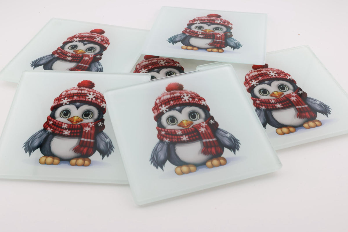 Christmas Penguins in Red Hats square glass coasters, photo of a finished set