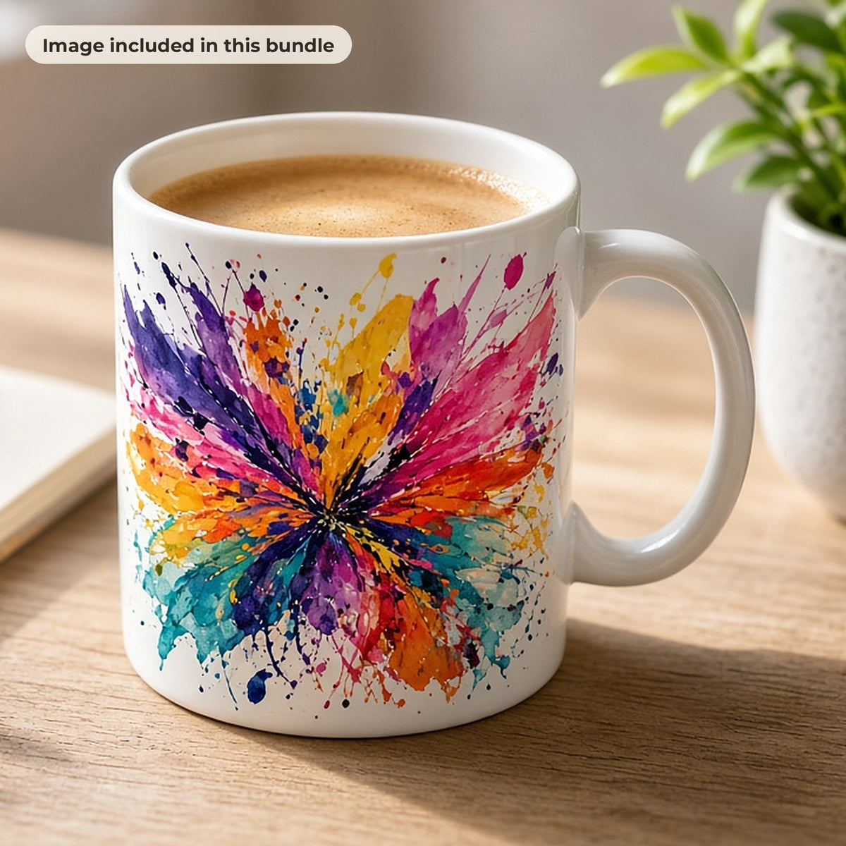 Abstract Art Collection: White mug printed with a colourful abstract splash burst on a desk with a sketchbook and paintbrushes (image from this bundle)