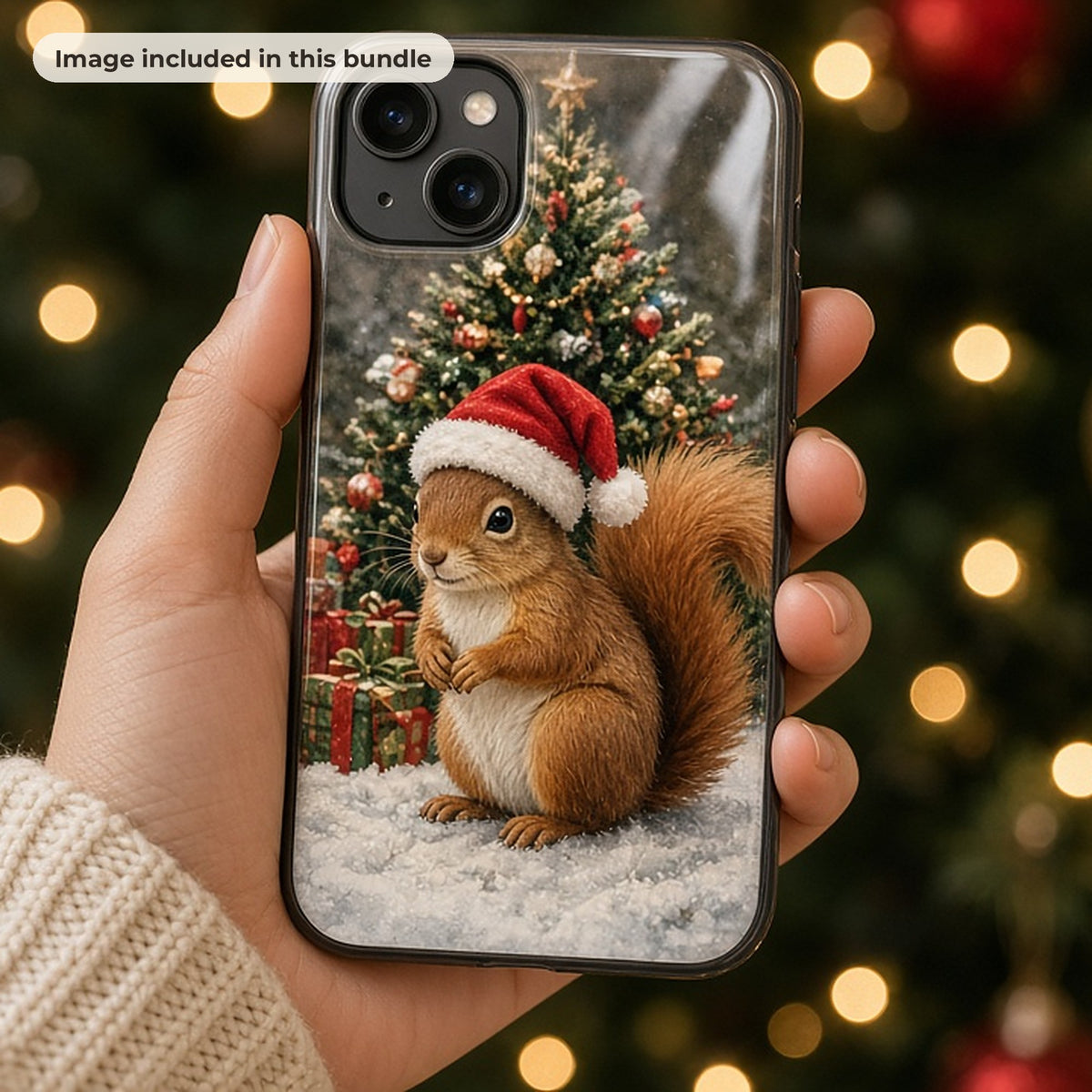 Christmas Art & Clipart Collection: Hand holding a phone case printed with a squirrel in a Santa hat beside a Christmas tree, in front of festive lights (image from this bundle)